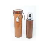 A large thermos flask, in a leather case, 36 cm