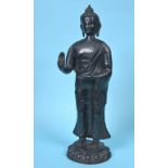 A large Nepalese Buddha, standing, on a lotus leaf base, 55 cm high See inside front cover colour