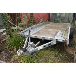 An Indespension 16' x 6'10" flatbed car transporter, with ramps from a garage dispersal. **This