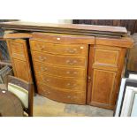 A Howard satinwood compactum (part), the serpentine section having five graduated long drawers,