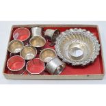 A set of six silver tots, Birmingham 1938, two silver bon bon dishes, and assorted silver napkin
