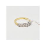 An 18ct gold and seven stone diamond ring, approx. ring size N Report by NG Approx. 3.4 g (all in)