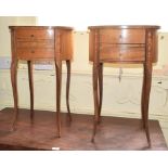 A pair of bedside cabinets, of oval form with inlaid decoration, 43 cm wide (2)