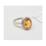 A 9ct white gold, yellow topaz and diamond cluster ring, approx. ring size S Report by NG Approx.