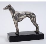 A silver figure, of a standing greyhound, mounted on a plinth base, London 1968, 13 cm high See