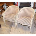 A pair of Continental carved and painted armchairs, with striped upholstery (2)