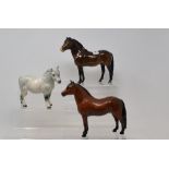 A Beswick Exmoor Pony, 1645, a Dartmoor Pony, Warlord, 1642, and a Shetland Pony, grey, H185, all
