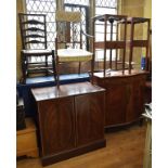 An Edwardian inlaid mahogany side cabinet, of serpentine outline with two frieze drawers above a