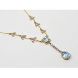 A 9ct gold, silver, blue topaz and diamond necklace Report by NG Modern