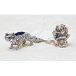 A novelty silver pincushion, in the form of a fox, 2.5 cm high, and another similar, in the form