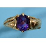 An 18ct gold abstract ring, set a purple stone, approx. ring size KÂ½ See illustration Report by