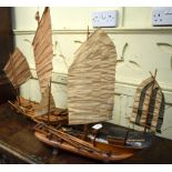 A Chinese wooden model of a junk, with living quarters, 57 cm high, and a Chinese wooden junk, 72 cm