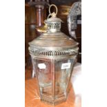 A steel hanging lantern, of hexagonal tapering form, with pierced decoration and cut glass panels,