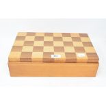 A chess set, the two piece box lid forming the chess board, 37 cm wide