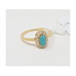 A turquoise and diamond cluster ring, in a yellow coloured metal setting, approx. ring size JÂ½