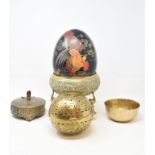 A Japanese lacquer egg shaped box, decorated chickens, 20 cm wide, an Indian brass bowl on stand, an