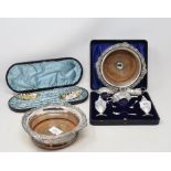 A pair of Victorian silver plated wine coasters, a silver plated condiment set, boxed, a similar