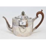 A George III silver teapot, of navette form, engrave foliage, Exeter 1802, approx. 14.5 ozt (all