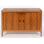 A Gordon Russell of Broadway sideboard, with a pair of helix pattern doors, 122 cm wide See