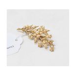 A 15ct gold and seed pearl floral spray brooch Report by NG Approx. 9.0 g (all in) Approx. 53 x 23
