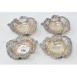 A set of four Edwardian silver bon-bon dishes, with pierced and embossed decoration, Sheffield 1909,