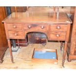 An early 19th century mahogany kneehole side table, on tapering turned legs, 98 cm wide