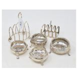 A pair of silver salts, marks rubbed, two other salts, and two toast racks, approx. 10.0 ozt (6)