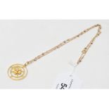 An 18ct gold pendant, the central flowerhead set a diamond, on a 9ct gold chain, approx. 7.7 g (