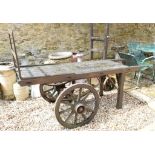 A Victorian luggage cart, from Sherborne Station, 199 cm wide, and a sack trolley with