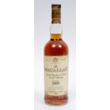 A bottle of Macallan whisky distilled in 1968 at Craig Ellachie, bottled in 1987, 43% vol, paper