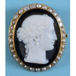 A hardstone cameo brooch, carved a head of a goddess, in a yellow coloured metal mount, with