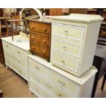 A painted wood chest, of two short and two long drawers, 107 cm wide, a matching dressing table