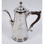 An 18th century silver coffee pot, crested, of slender baluster form, John Kirkup, Newcastle 1754,