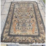 An Eastern rug, decorated animals and flowers on a cream ground, within a multi border, 225 x 139 cm