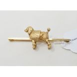 A 9ct gold poodle bar brooch, approx. 12.0 g