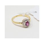 An 18ct gold, ruby and diamond cluster ring, approx. ring size NÂ½ Report by Ng Approx. 2.7 g (all