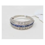 A sapphire and diamond half band ring, a white coloured metal setting, approx. ring size MÂ½