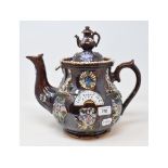 A Bargeware teapot and cover, 'GOD BLESS OUR HOME', slight restoration, 28 cm high Report by NG