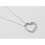 A 9ct white gold heart shaped pendant, on a 9ct white gold chain, approx. 3.9 g (all in)