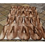 A jackal skin rug, with felt backing, 238 x 147 cm