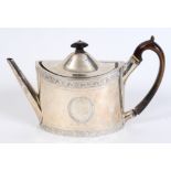 A late 18th century silver teapot, initialled, of navette form, with engraved decoration, London