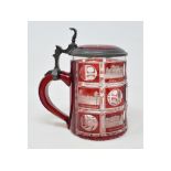 A 19th century Bohemian ruby flash glass tankard, decorated named properties, with pewter mounts,