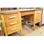 An oak kneehole desk, 137 cm wide