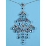 An 18ct white gold, blue topaz, blue sapphire and diamond chandelier necklace, the large pendant