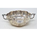 A Victorian silver two handled bowl, of circular lobed form, with embossed decoration, London