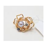 A 1970s 18ct gold and cultured pearl dress ring, approx. ring size OÂ½ Report by NG It is approx.