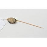 A stick pin, with carved scarab beetle finial