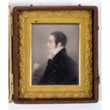 A 19th century bust portrait miniature, the gentleman wearing a white cravat and a blue overcoat,