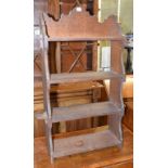 An Arts and Crafts oak bookcase, of small proportions, bears a plaque, Princess Christian