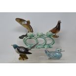 A Beswick Pigeon, 2nd version, red, 1383B, a Cuckoo, 2315, a Trout, 1032, a novelty candlestick,